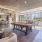 Luxury Two-Bedroom Apartments in San Francisco, CA - Etta Apartments - Clubhouse with Couch Seating, a Billiards Table, and a Kitchen Area