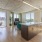 Apartments in Nob Hill, San Francisco, CA - Etta Apartments - Living Room with Floor-to-Ceiling Windows, Hardwood Flooring, and Concrete Accent Walls