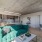 large room with blue couch 